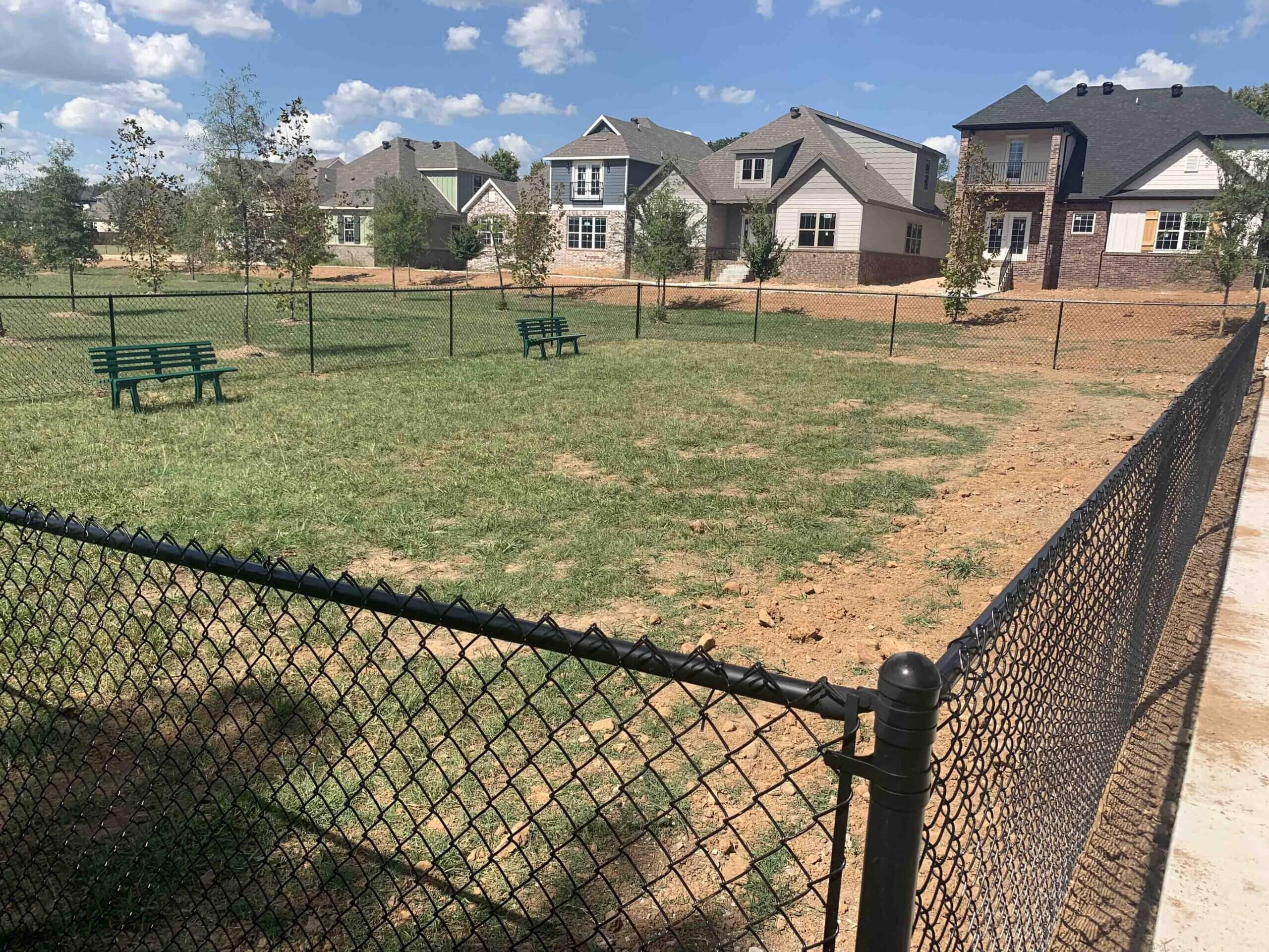 Photo of a black vinyl-coated chain link fence in Springdale, AR